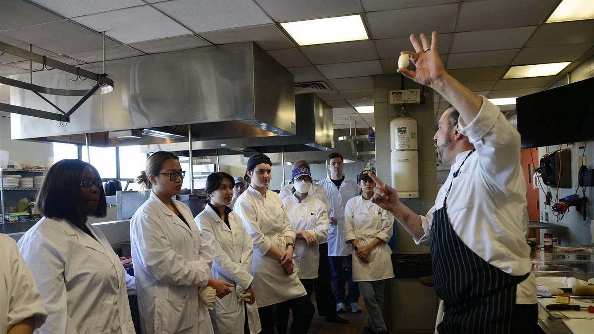 Chef Rich Pepino demonstrates the size and shape of ciliegine mozzarella.