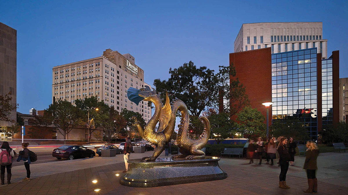 A city street with a dragon statue