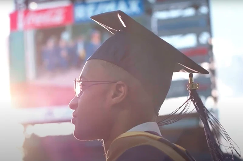Profile perspective of an individual in a cap and gown