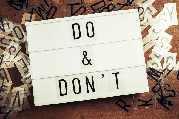 A lightbox displaying the message "DO & DON'T" with scattered letter tiles around it.